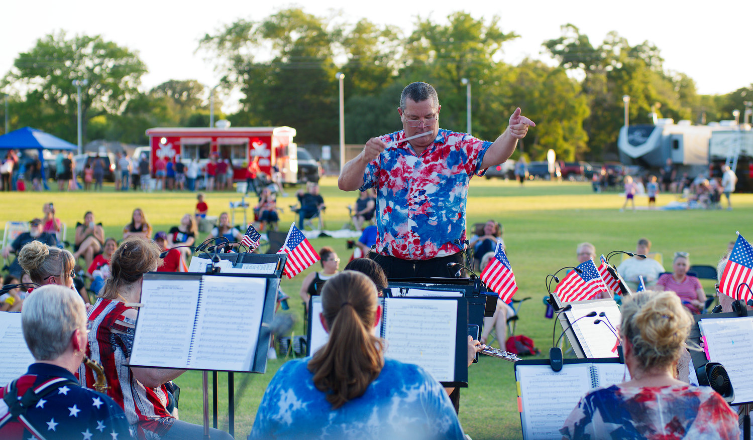 Kelly Bennette directs the Lake Country Symphonic Band with a concert of patriotic songs Monday.